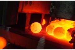 How are grinding balls heat treated?
