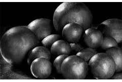 Why are grinding media balls used?